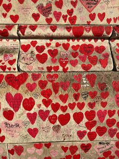 many red hearts are on the wall