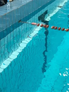 an empty swimming pool with people in it