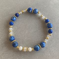 Lapis Lazuli Gemstone and White Pearl Bracelet Arrives ready for gifting and usually ships same day or next day. The necklace will be sent with a gift! O T H E R ∙ I N F O R M A T I O N Lapis Lazuli size: 8 mm Lapis Lazuli size: 6 mm Pearl size: 5-6 mm Crystal size: 3 mm **Intermediate apparatus and beads are non-tarnish gold plated. ☆ Each of our bracelets at PEARLOWNJEWELRY are handmade and special natural stones. Bracelet and necklace are made with positive energy. Each crystal is cleaned bef Adjustable Blue Pearl Bracelet Gift, Adjustable Blue Pearl Bracelet For Gift, Blue Spiritual Beaded Bangle Bracelets, Blue Beaded Crystal Bracelet For Meditation, Adjustable Lapis Lazuli Beaded Bracelet With Faceted Beads, Spiritual Blue Beaded Bangle Bracelets, Blue Bracelet With Faceted Beads For Gift, Blue Faceted Beads Bracelet For Gift, Blue Bracelets With Faceted Beads As A Gift