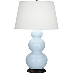 a blue lamp with a white shade on it