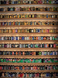 the shelves are filled with many different types of cans