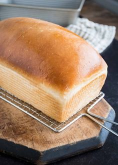 a loaf of bread sitting on top of a cooling rack