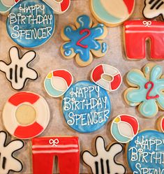 decorated cookies are arranged in the shape of letters and numbers