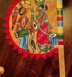 a wooden stick with an image of people on it