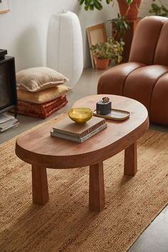 a living room with two couches and a coffee table in the middle of it