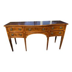 an antique wooden desk with two drawers