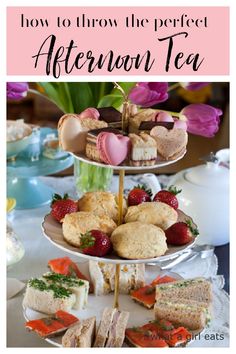 the afternoon tea is served on three tiered trays, with pink flowers in the background