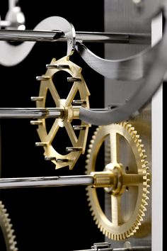 a clock with gears attached to it's sides