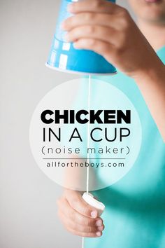 a woman holding a blue cup with the words chicken in a cup