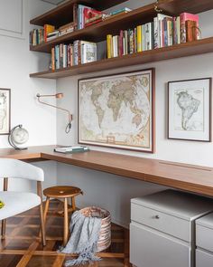 a home office with bookshelves, desk and chair