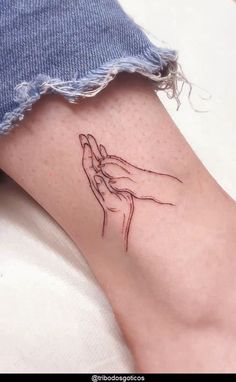 a woman's foot with a small tattoo on the side of her left leg