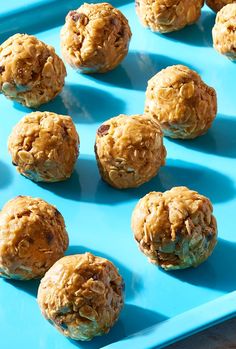 several balls of oatmeal sitting on a blue tray