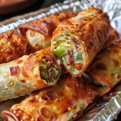 If you're craving a savory, crunchy snack with a spicy kick, these Bacon Jalapeño Popper Egg Rolls are just what you need! These delectable bites are packed with the creamy goodness of cream cheese, crispy bacon, and zesty jalapeños, all wrapped up in a golden, crispy egg roll shell. What makes these egg rolls so special is their delightful blend of flavors and textures—the creamy filling combined with the crunch of the egg roll shell makes for an irresistible appetizer or party snack. These ... Pickle Egg Rolls, Jalapeno Egg Rolls, Bbq Egg, Bacon And Egg Roll, Egg Roll Filling, Bacon Jalapeno Poppers, Crispy Egg