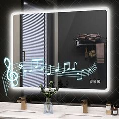 a bathroom mirror that has musical notes on it and is lit up in the dark