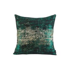 a green and gold pillow on a white background