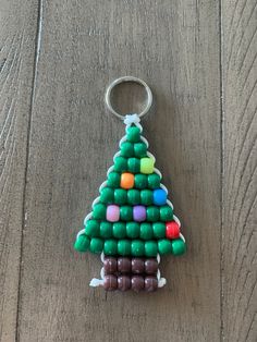 a christmas tree made out of candy on top of a wooden table