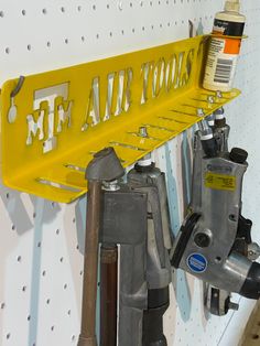 there is a yellow shelf with tools on it