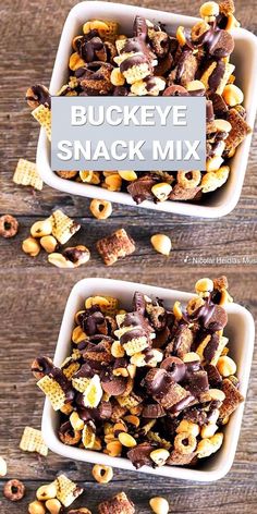 two bowls filled with snack mix on top of a wooden table