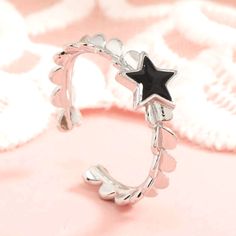 This Pretty And Dainty Star Ring Will Look Great On Any Finger! -Color - Silver Cuff Ring -Black Star -Material - Zinc Alloy -Equivalent To Size 9 Offers Welcome! -Smoke Free Home! -Fast Shipping! -Top Rated Seller! Black And Silver Rings, Silver Star Ring, Adjustable Star-shaped Midi Rings, Star Rings, Silver Cuff Ring, Cuff Rings, Star Ring, Black Star, Really Cute Outfits