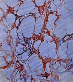 an abstract painting with red, blue and white colors on it's surface is shown