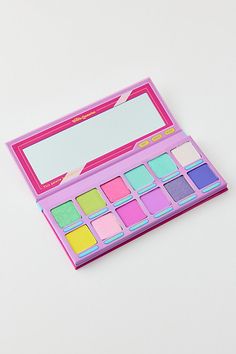 A 12-pan eyeshadow palette from Trixie Cosmetics inspired by the nostalgic colors of childhood. This eyeshadow palette features a blend of shimmering and matte shades and is complete with a sticker sheet so you can customize your new favorite palette. Features Trixie Cosmetics Girl Talk 12-Pan Eyeshadow Palette 12 Shades in shimmering & matte finishes Sticker sheet to decorate your new go-to eyeshadow palette Vegan & cruelty free Shades Cooties: Catching light green with gold and blue reflects S Glamlite Palette, Trixie Cosmetics, Speed Dial, Pink Metallic, Gold And Blue, Sugar Rush, Blue Raspberry, Girl Talk, Wellness Gifts