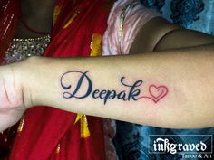 a woman with a tattoo on her arm saying, deepak