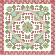 a green and red quilt on a white background with an image of a flower in the center