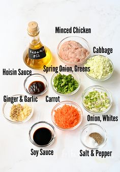 the ingredients to make chicken broth laid out on a white counter top, including carrots, onions, celery, and seasoning