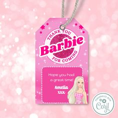 a pink tag with the words barbie on it