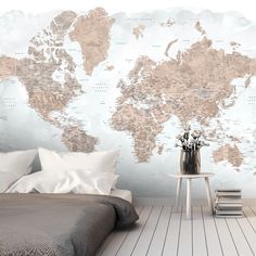 a bedroom with a large map on the wall