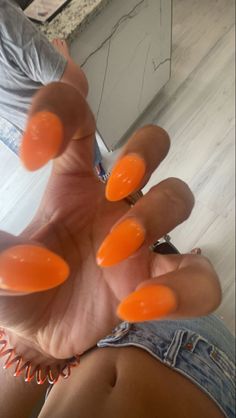 Neon Orange Nails Coffin, Orange Almond Shaped Acrylic Nails, Nail Inspiration Almond Summer, Sold Color Almond Nails, Cute Light Orange Nails, Nail Inspo April 2024, Solid Color Nails Orange, Almond Shaped Orange Nails, Orange Solid Nails