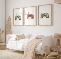 a bedroom with three framed pictures on the wall