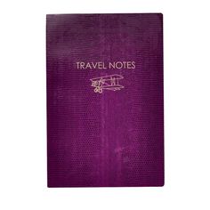 a purple book with the words travel notes written in gold on it and an airplane