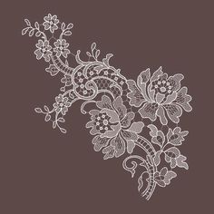 a white lace with flowers on a brown background