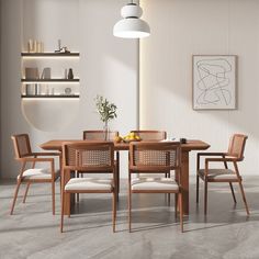 a dining room table and chairs in front of a wall with shelves on the other side