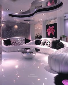 a living room filled with lots of white furniture