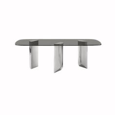 a glass table with three metal legs on the bottom and one leg in the middle