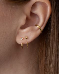 or Save $60 with Sets here The Huggie Ear Jackets are the most versatile and creative ear jackets. With their open hoop design, they're a fresh way to create one-of-a-kind earring looks when attached behind the lobe or in front with your favorite studs. Handcrafted in 14K gold vermeil - a thick 14K gold layer on sterling silver Made from recycled precious metals. Measures 13mm in diameter and is 1.2mm thick. Sold as a pair Free shipping on orders over $120 & 30-day returns learn more Earring Looks, Kids Studs, Custom Cast, Unique Earring, Front Back Earrings, Ear Jacket Earring, Earring Jackets, Hoop Design, Solitaire Studs