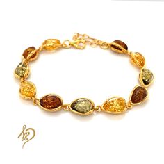 Delicate but very effective Bracelet with Baltic Amber It is made of gold-plated 925 silver (Ag 925) We are plating our Goods with a thick layer of gold, therefore You can be satisfied with quality for ages. Standard length of this bracelet is around 16,5 cm, but there is a possibility to make it a little bit longer (up to 20,5 cm)  because of the chain we put in the end. Bracelet is made of individual elements made of silver gold-plated and Baltic Amber. Cabochons in bracelets are available in different version (green, cognac, yellow or mix of 3 colours ). This natural stone is very unique, and each of them may look a little bit different from another. This is for sure the biggest advantage of Baltic Amber. You could have the same bracelet with your friend, but they won't be exactly the s End Bracelet, Baltic Amber Jewelry, Brown Bracelet, Amber Bracelet, Amber Earrings, Amber Ring, Amber Jewelry, 925 Jewelry, Baltic Amber