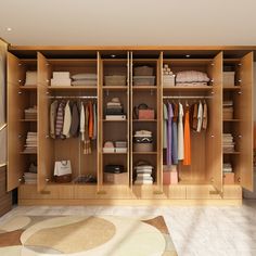 an organized closet with clothes, shoes and other items on shelves in the center of the room