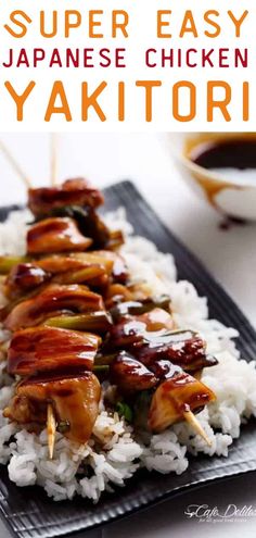 chicken kabobs on top of white rice with chopsticks