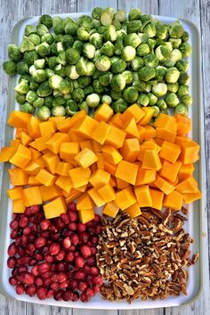 a platter filled with different types of fruits and vegetables