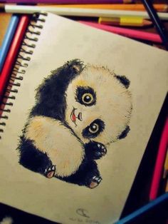 a drawing of a panda bear sitting on top of a pile of colored pencils