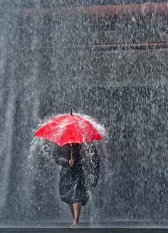 a woman walking in the rain with an umbrella over her head and words above it