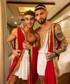 two men in roman garb standing next to each other