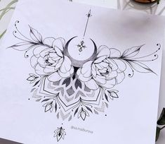 a drawing of flowers and a clock on a piece of paper