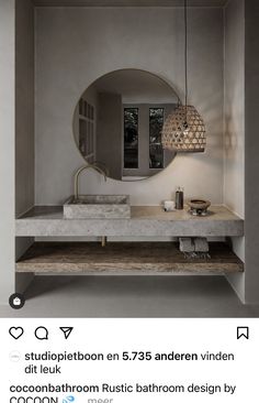 a bathroom sink sitting under a mirror next to a counter top with a light on it