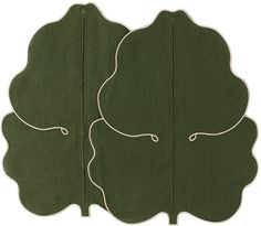 two green rugs with white trim on them