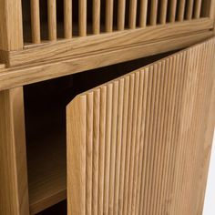 a close up of a wooden shelf with shelves on it's sides and the bottom section showing wood slats