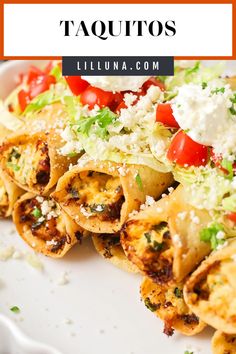 taquitass with tomatoes, lettuce and feta cheese on top